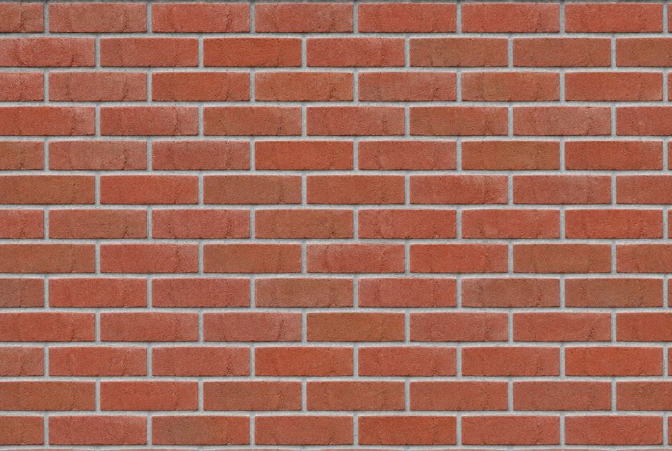 A red brick wall where each row of bricks is shifted half a brick from the row below.