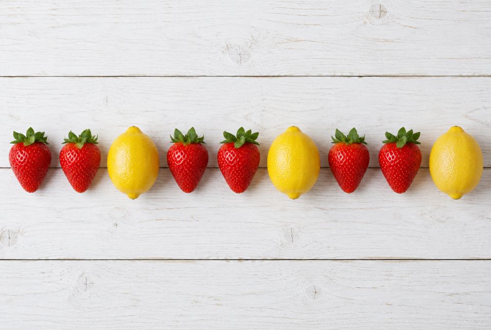 A row of real fruit: strawberry, strawberry, lemon, repeated three times.